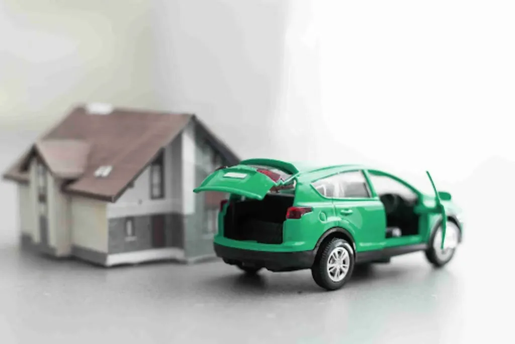 Hybrid Auto Transport: Terminal + Door Mix for Smart Savings Model car beside a house representing hybrid auto transport solutions for residential moves using rail and truck delivery.