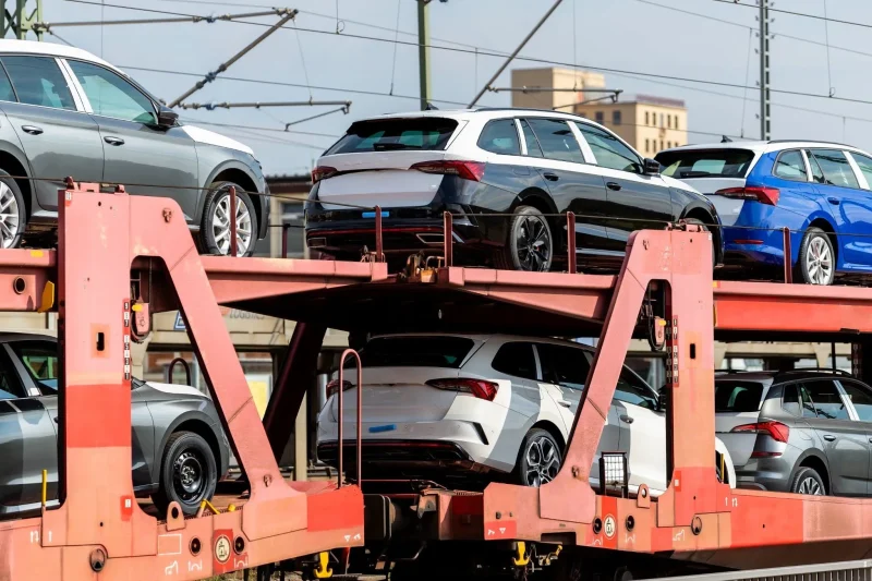 Corporate car shipping using rail transport to move new fleet vehicles between distribution centers