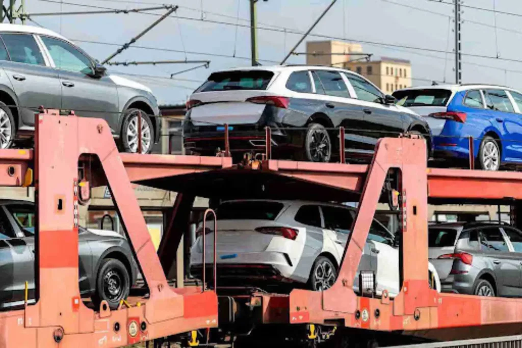 Hybrid Auto Transport: Terminal + Door Mix for Smart Savings Vehicles loaded on a rail auto carrier, showing the rail segment of hybrid auto transport for long-distance efficiency.