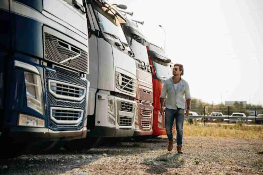 Why Most Auto Transport Companies Are Brokers (And Why That’s Not a Scam) Fleet of carrier trucks illustrating why most auto transport companies operate as brokers in the industry.