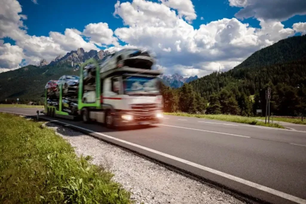 How Much Does It Cost to Ship a Car From Arizona to Texas? Auto transport truck on highway illustrating how to Ship a Car From Arizona to Texas using a professional carrier.