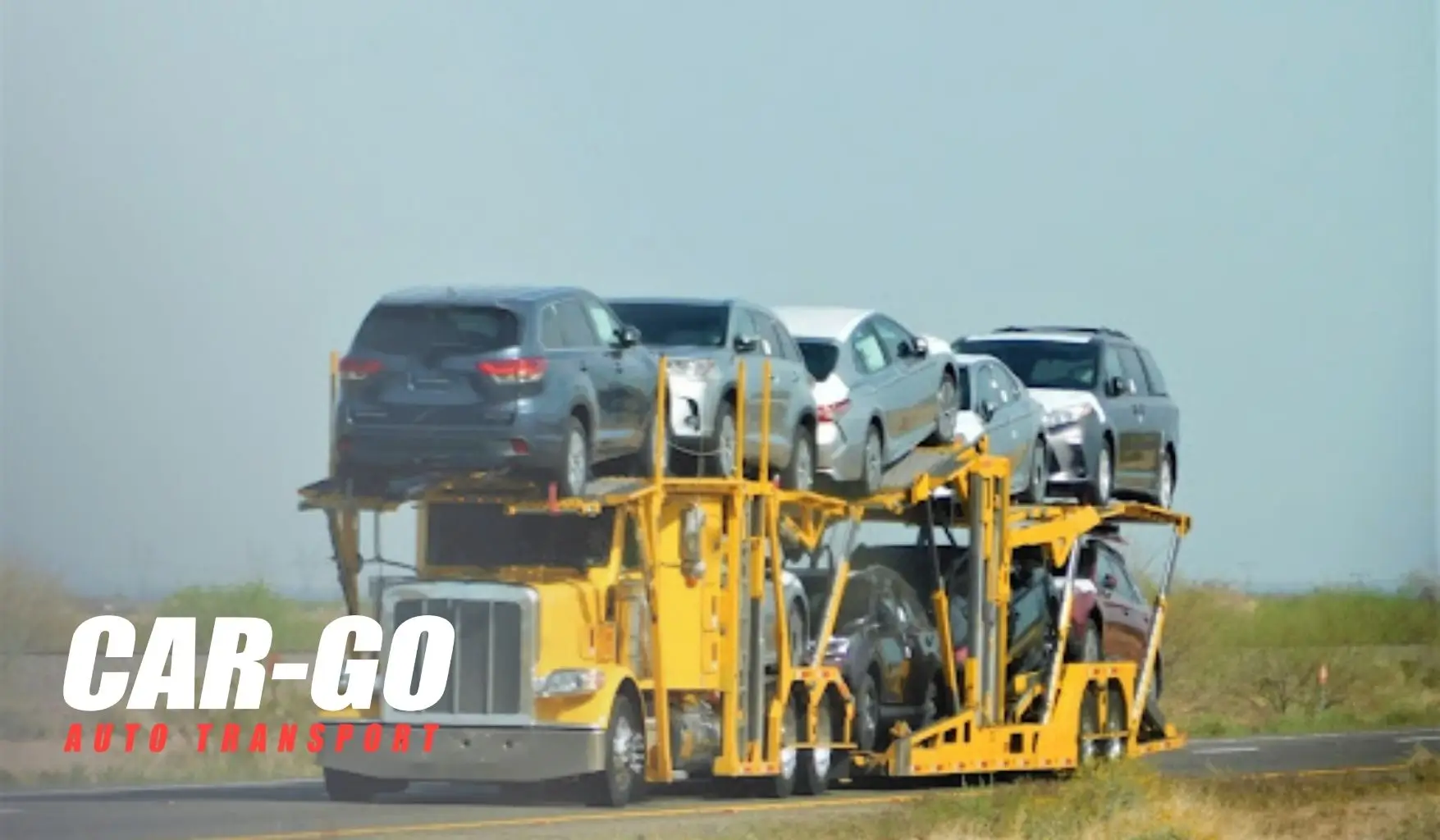 Car carrier transporting multiple vehicles on highway for customers shipping a car bought online across states.