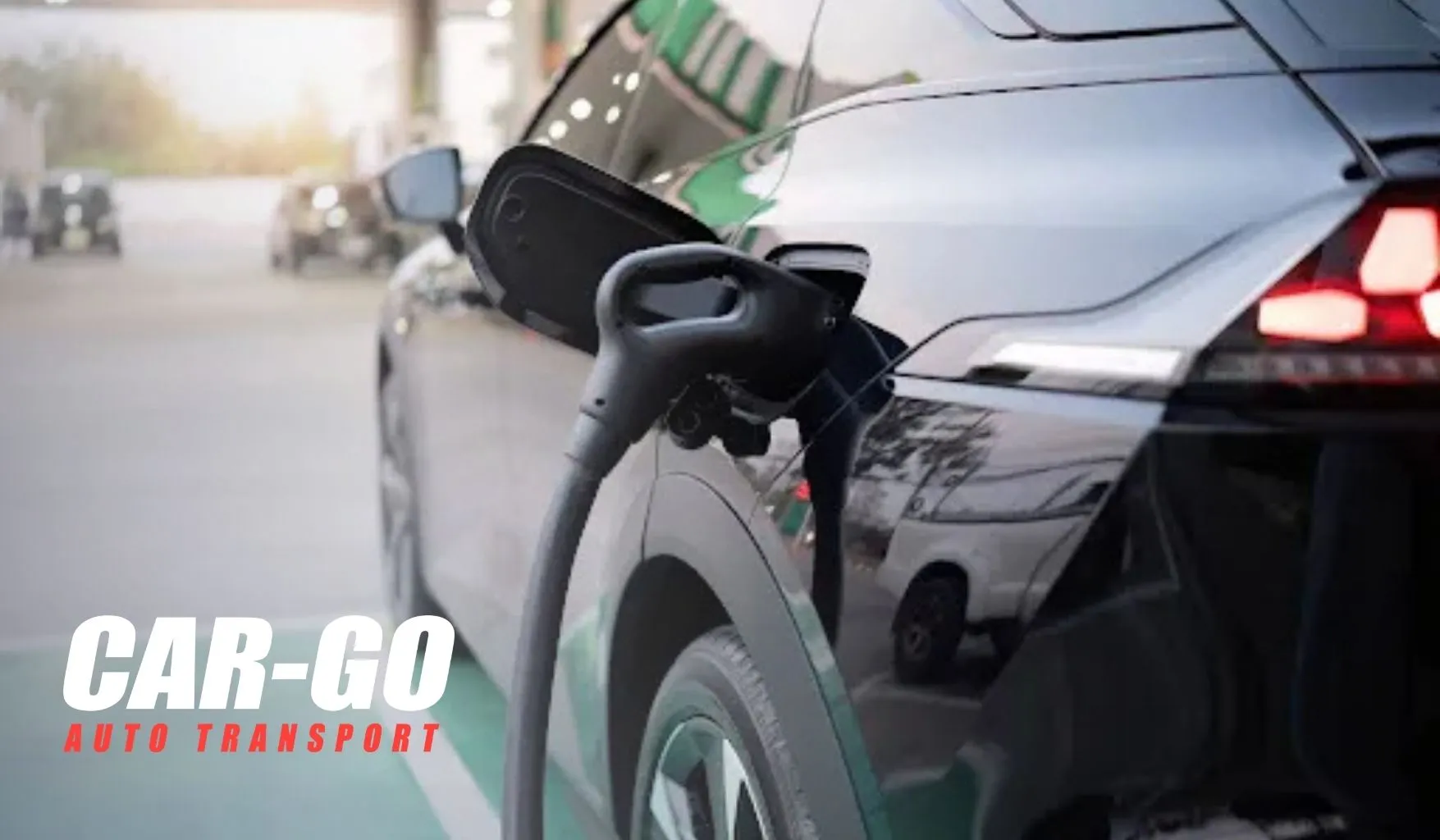 Electric SUV at a charging station related to auto transport electric vehicles and EV shipping logistics.