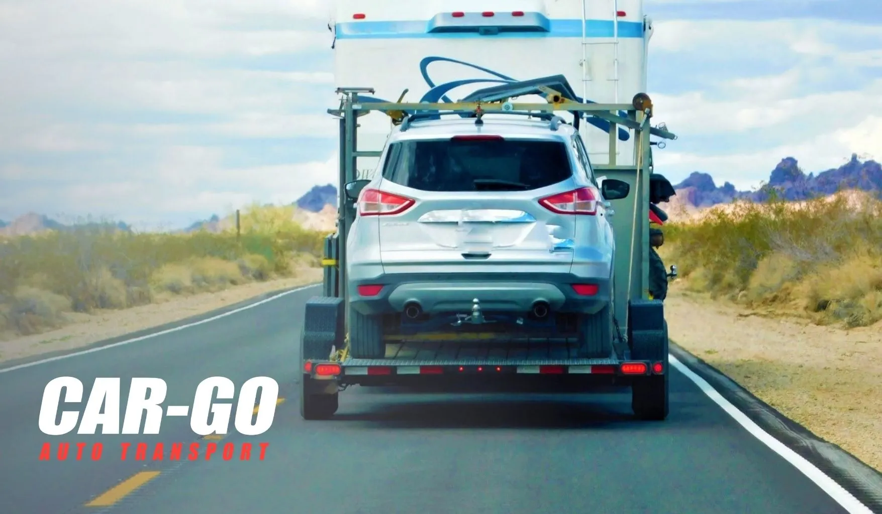 ship-car-out-state-suv Ship car to out of state buyer as an SUV and travel trailer are transported along a desert highway.